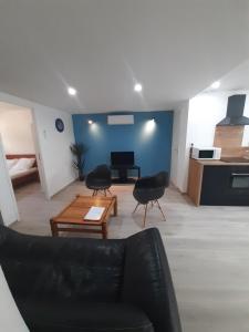 Appartement 50m2 rez de chaussée en plein centre ville garage gratuit