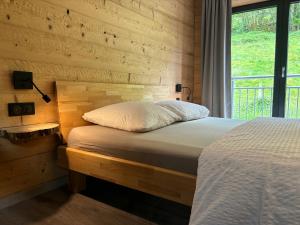 Appartements La Ferme de Rochesson, Jacuzzis & Piscine commune : photos des chambres