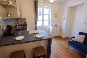 Appartements Une petite escale dans le centre historique : photos des chambres