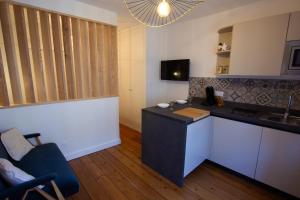 Appartements Une petite escale dans le centre historique : photos des chambres