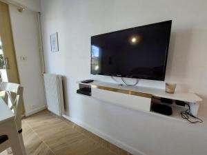 Appartements Studio L'echappee avec lit double et parking sous-sol privatif : photos des chambres