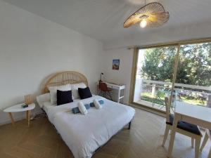 Appartements Studio L'echappee avec lit double et parking sous-sol privatif : photos des chambres