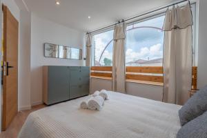Appartements Suites Kerlarros Clim et Parking face Gare et Port : photos des chambres