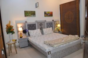 Holidazzle Residences DHA Karachi