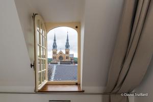 Appartements Suites Mana - Te Fiti en Plein Centre de la Place Ducale avec vue sur les toits : photos des chambres