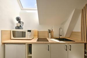 Appartements Le Petit Hugo - Centre Ville - Parking : photos des chambres