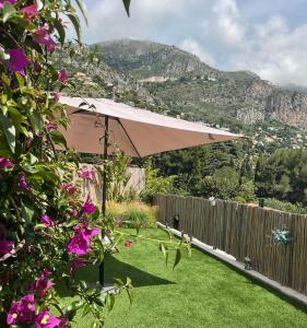 Appartements Un coin de paradis avec vue Mer et jardin : photos des chambres