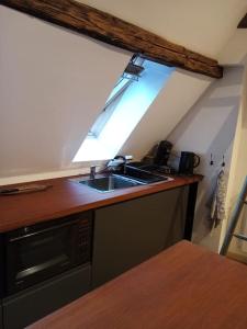 Appartements Studio cosy dans maison alsacienne : photos des chambres