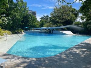 Condo with Private Beach at Tambuli Beach Resort near Airport in Cebu