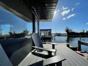 Poellodge, Luxe houseboot met zonnig terras - Aalsmeerderbrug