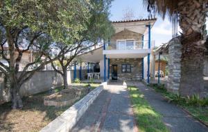 Cycladic stone house by the sea