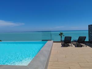 Appartements Pearl Beach - Rooftop Pool Seaside : photos des chambres