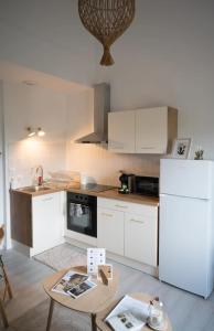 Appartements Le beau Lucien, climatise, central et fonctionnel : photos des chambres