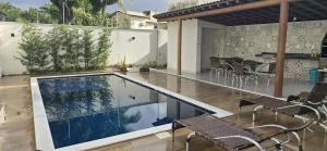 Casa Harmonia - 03 quartos sendo 01 suíte, próximo da praia, com piscina e área de churrasco