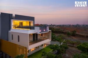 StayVista at Majestic Whispers with Rooftop Pool