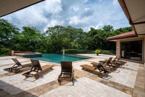 Stunning Luxury Penthouse in Exclusive Beachfront Community with Resort-Style Amenities & Sweeping Views of the Ocean & Golf Course