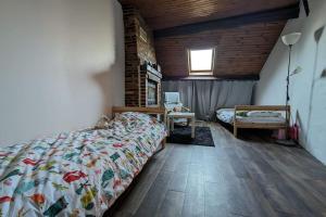 Maisons de vacances Maison de village - Jardin - 8 min de Center Parcs : photos des chambres