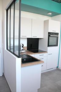 Appartements Le Freesia, a 20m de la plage, 5 min du centre-ville : photos des chambres