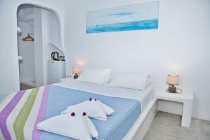 Double Room with Balcony and Caldera View room in The Last Sunbeam