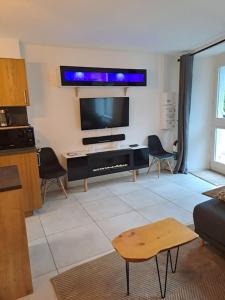 Appartements Au coin des Thermes - Draps en option : photos des chambres