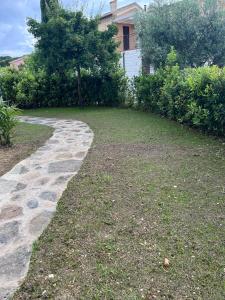 Casa Antia, nuovo bilocale con giardino in Residence con piscina