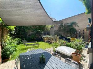 Appartements Un jardin en ville : photos des chambres