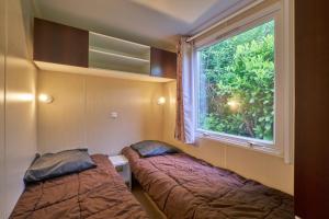 Campings Mobil Home 4 personnes 208 : photos des chambres