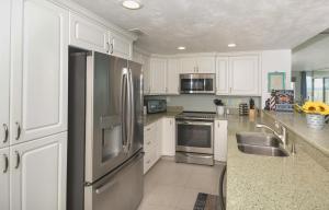 Ocean Condo 104 ~ Ground Floor Corner Condo with wrap around balcony Walk right out to Pool