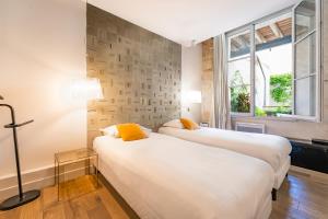 Magnifiques Appartements sur les Quais de Bordeaux : photos des chambres