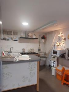 Appartements Gite EMOZIONE : photos des chambres
