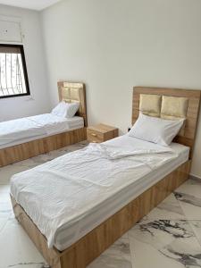 Chambre à Agdal Rabat dans un appartement partagé -two single beds-