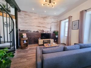 Appartements Duplex Le Chai de l-Abreuvoir : photos des chambres