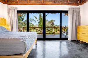 Casa Vela Palafito en playa con alberca