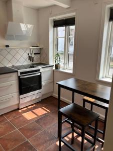 Charmerende byhus midt i Assens