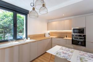 Villas Superbe maison proche de Paris! : photos des chambres