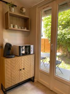 Appartements Les Embruns - Studio avec jardin : photos des chambres