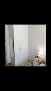 Private room with balcony in shared Design apartment 8 minutes away from center and exactly In front of the metro station