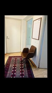 Private room with balcony in shared Design apartment 8 minutes away from center and exactly In front of the metro station