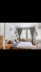 Private room with balcony in shared Design apartment 8 minutes away from center and exactly In front of the metro station