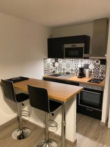 Appartements Le petit Langrois : photos des chambres