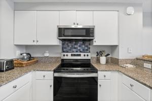 Modern Beachfront Condo on the Beach Sleeps 6! by Dolce Vita Getaways PCB