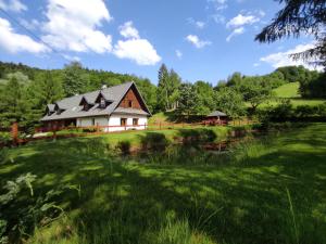 Domki "Nad Rzeką Solinką" Tomasz Pasławski