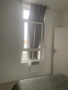 Appartements Calaisfornia1 : photos des chambres