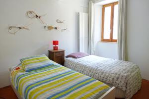 Maisons de vacances Grande maison de village 200 m2 calme tout confort : photos des chambres