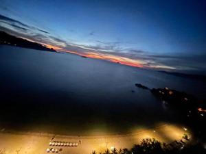 Sunrise from bed Apartment - NhaTrang Beach