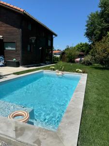 Maisons de vacances Le Lodge de l'ocean - Maison familiale en bois neuve - Piscine chauffee : photos des chambres
