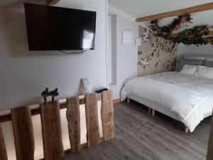 B&B / Chambres d'hotes La maison du Bonheur, borne de recharge VE : photos des chambres