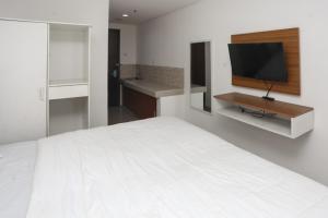 RedLiving Apartemen Enviro Cikarang - Stars Rooms