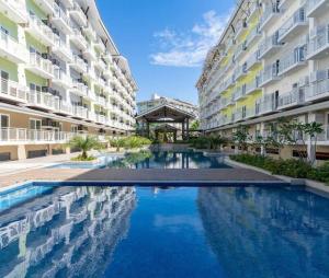 212B Amani Grand Resort Residences near Mactan Airport with pool, gym, wifi, netflix