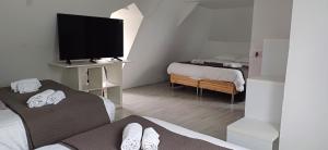 Maisons de vacances Gite isigny omaha : photos des chambres